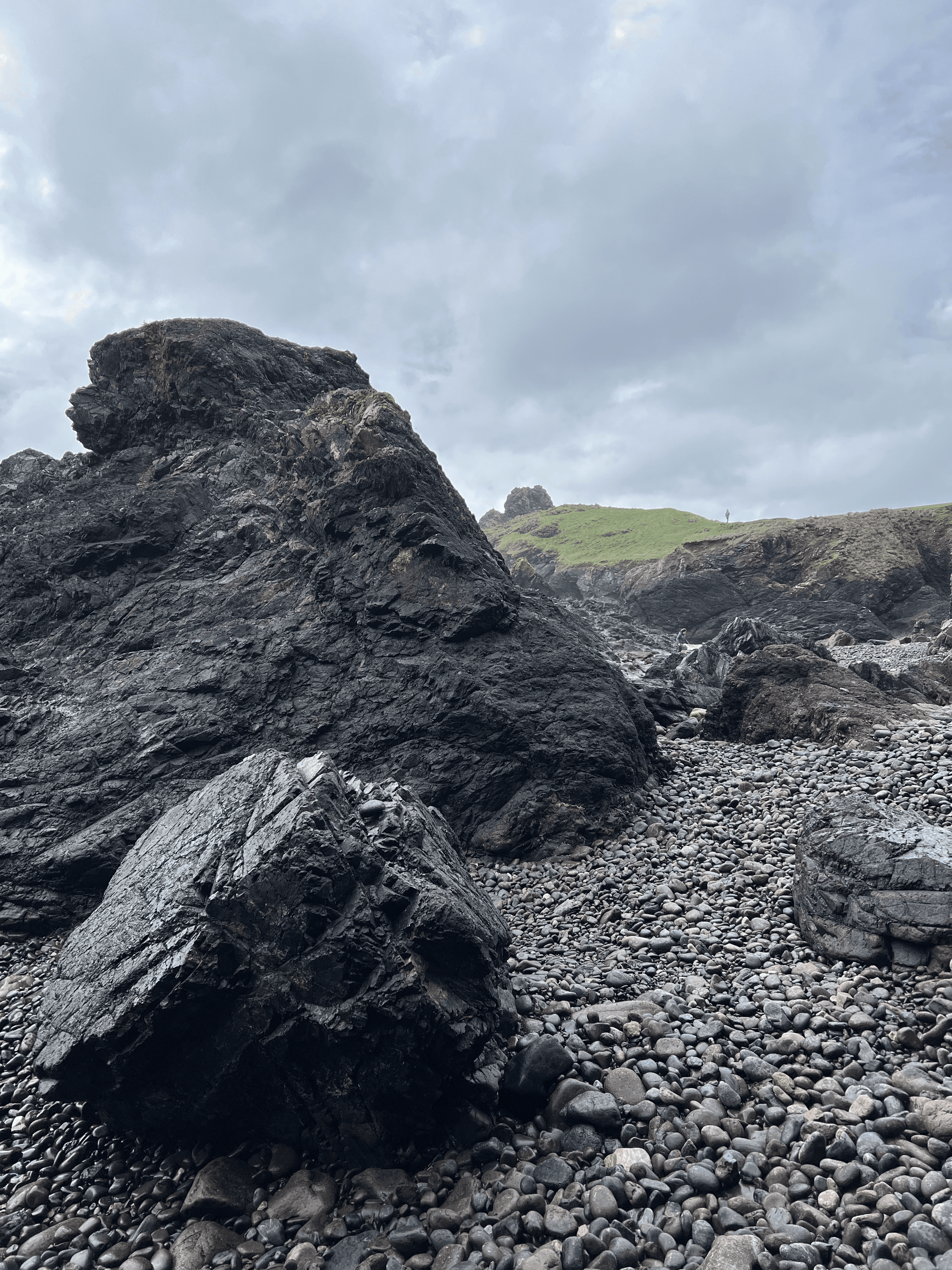 Rock in foreground with preson in background